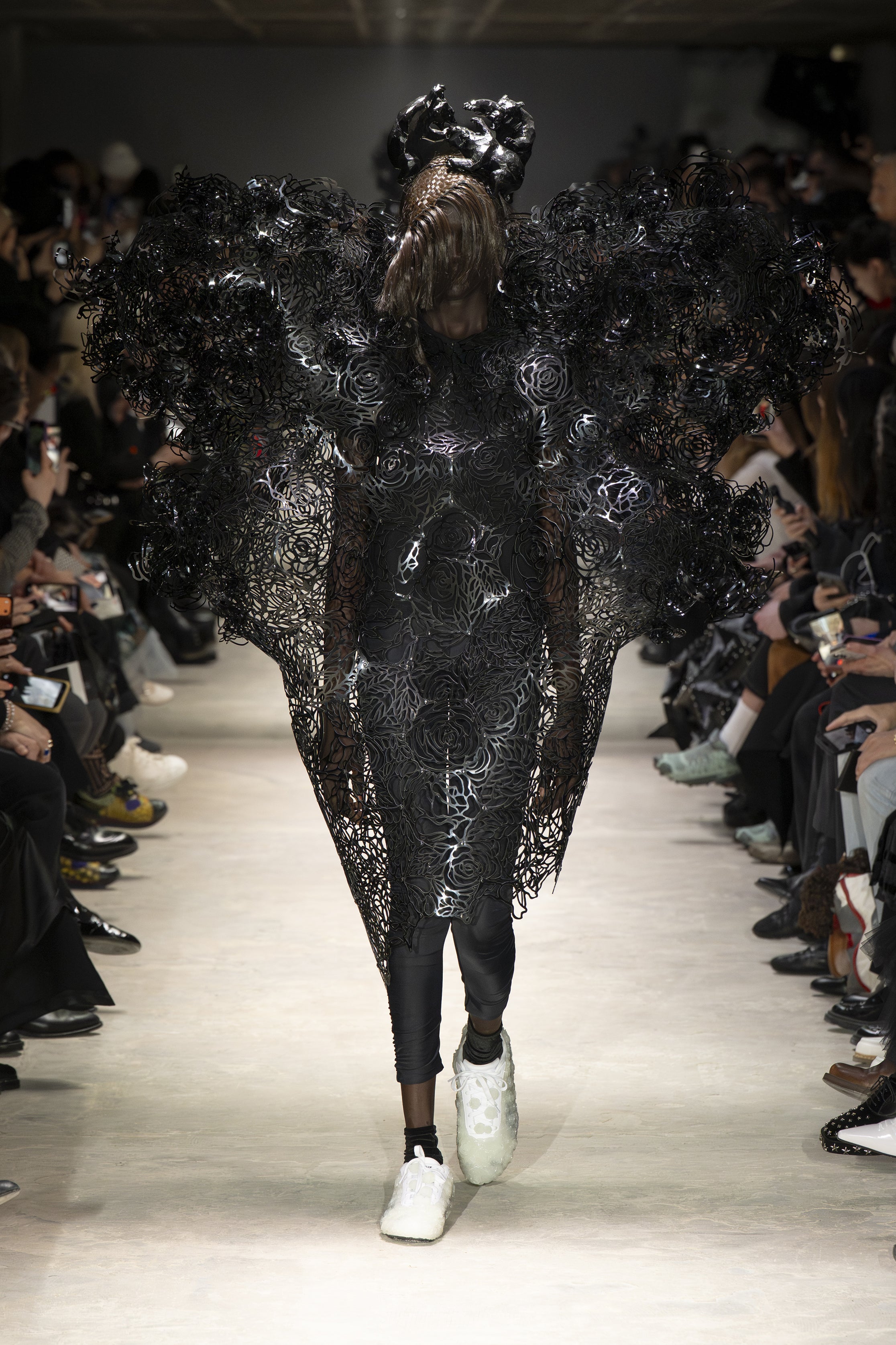 Fashion model wearing a NOIR KEI NINOMIYA AW26 outfit