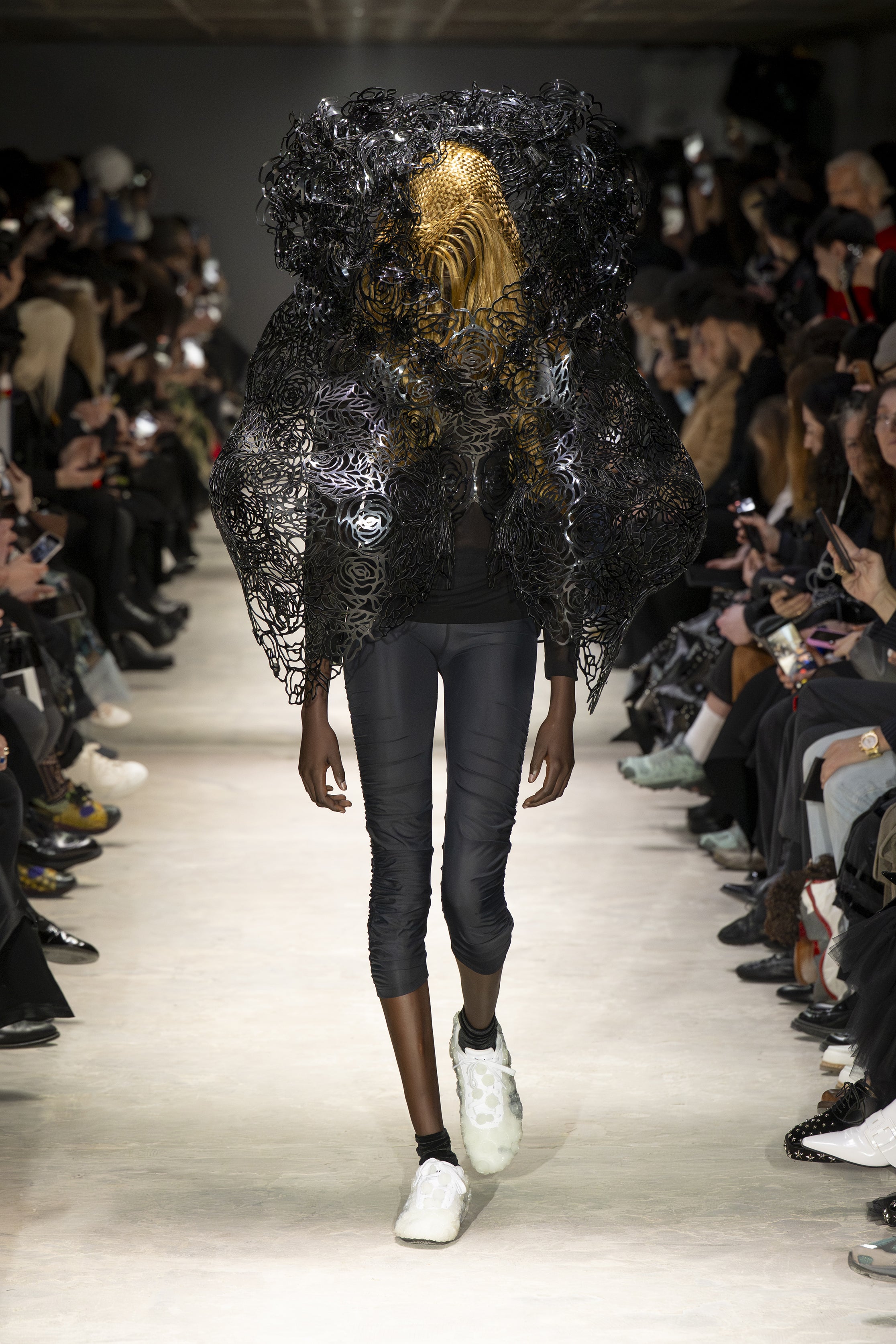 Fashion model wearing a NOIR KEI NINOMIYA AW26 outfit