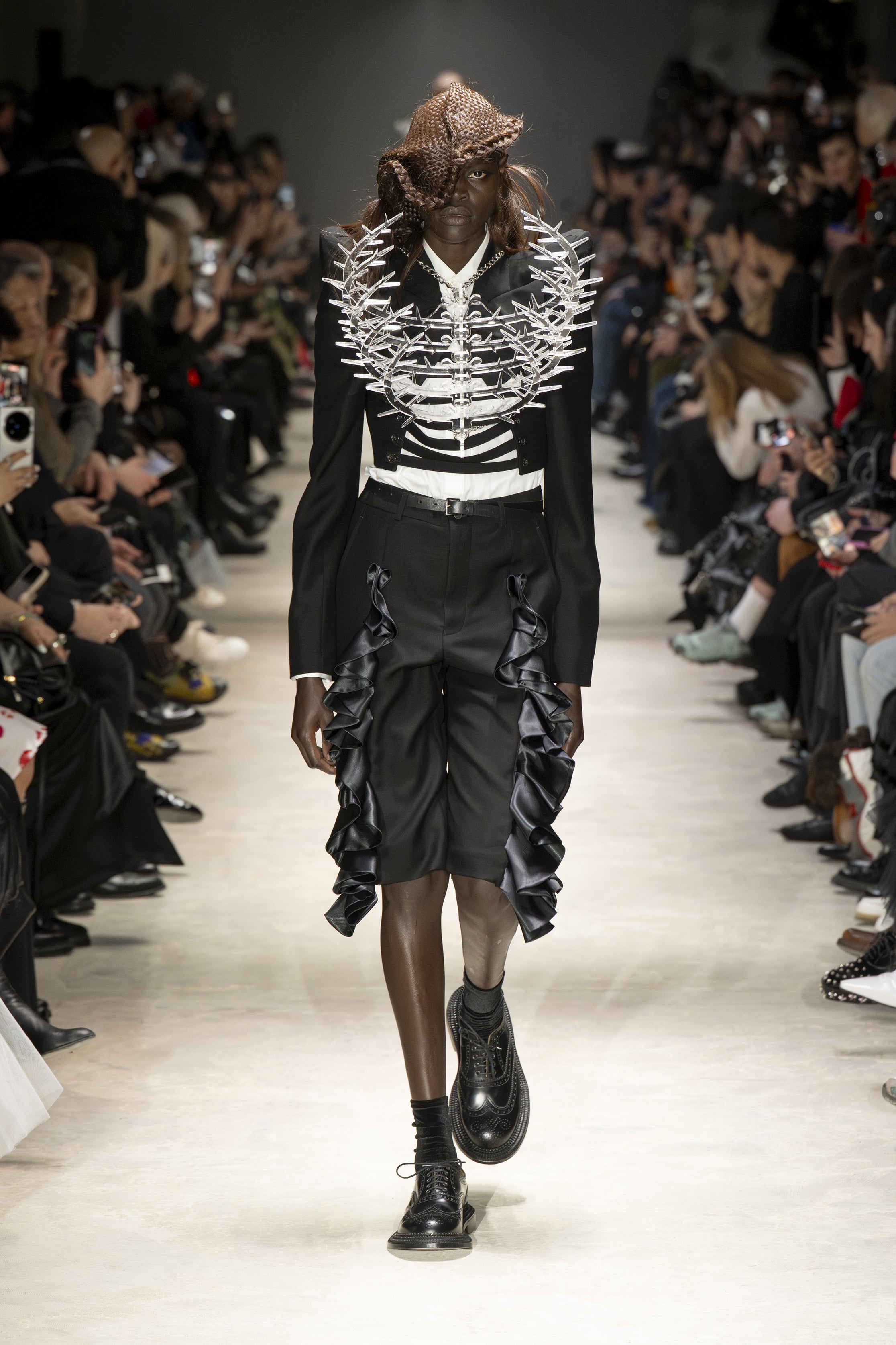 Fashion model wearing a NOIR KEI NINOMIYA AW26 outfit