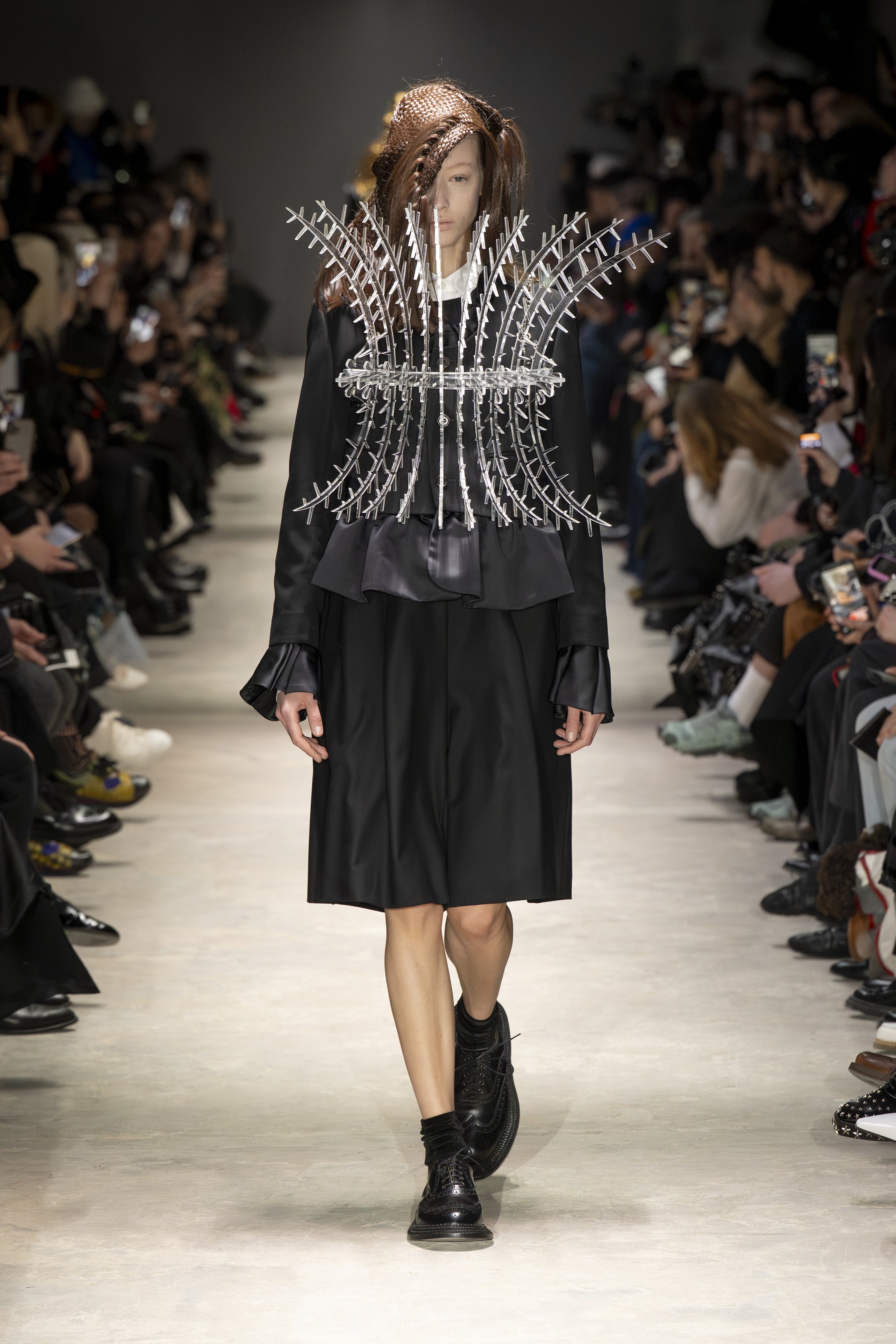 Fashion model wearing a NOIR KEI NINOMIYA AW26 outfit
