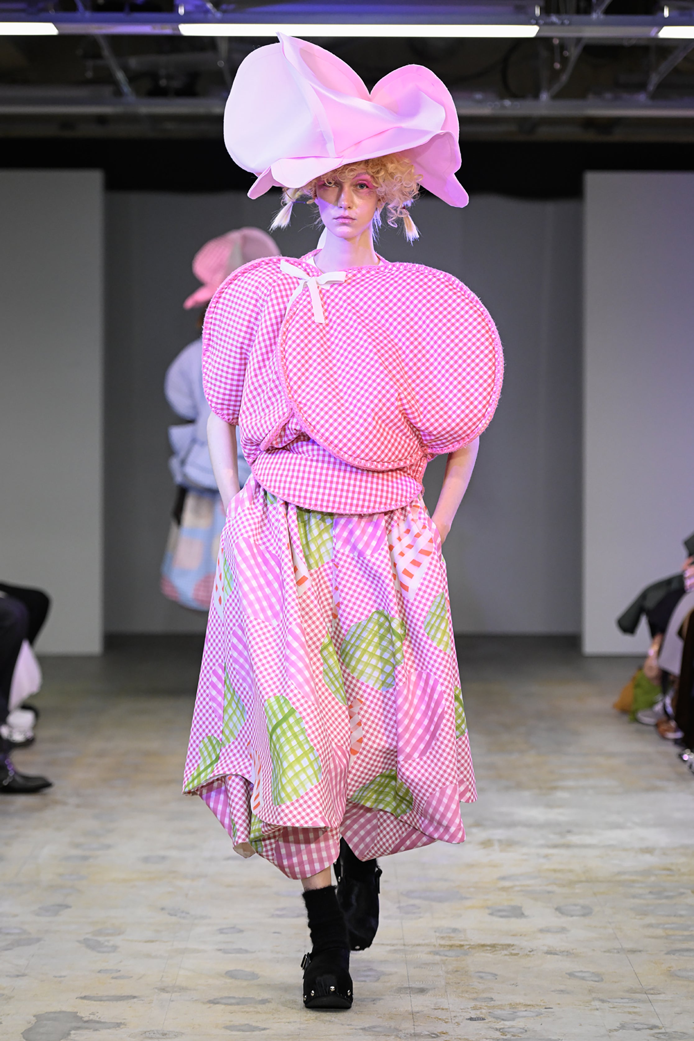 Fashion model wearing a tao AW26 outfit
