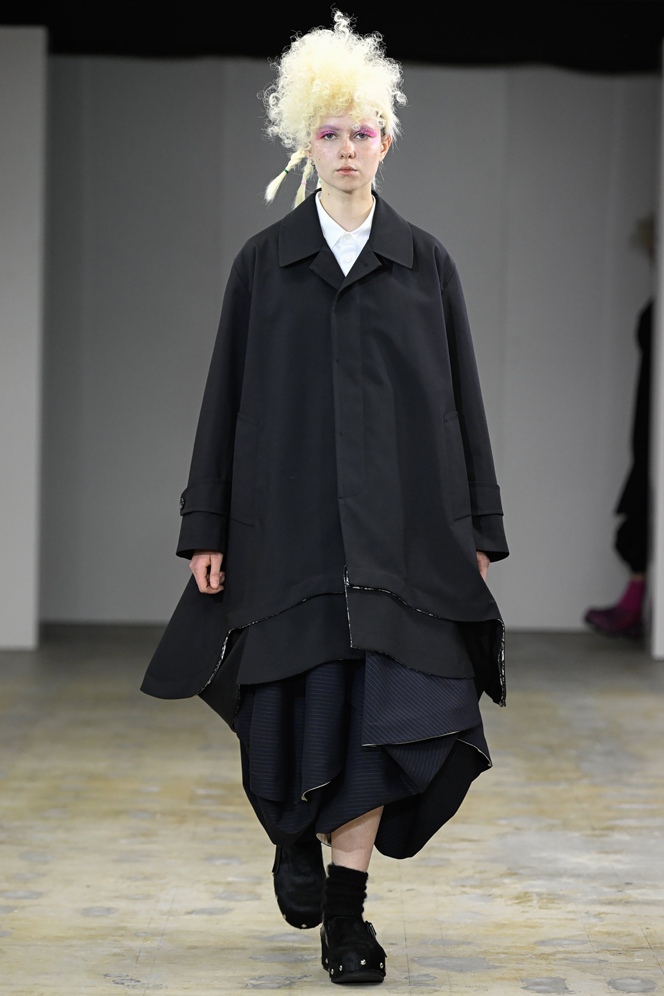 Fashion model wearing a tao AW26 outfit