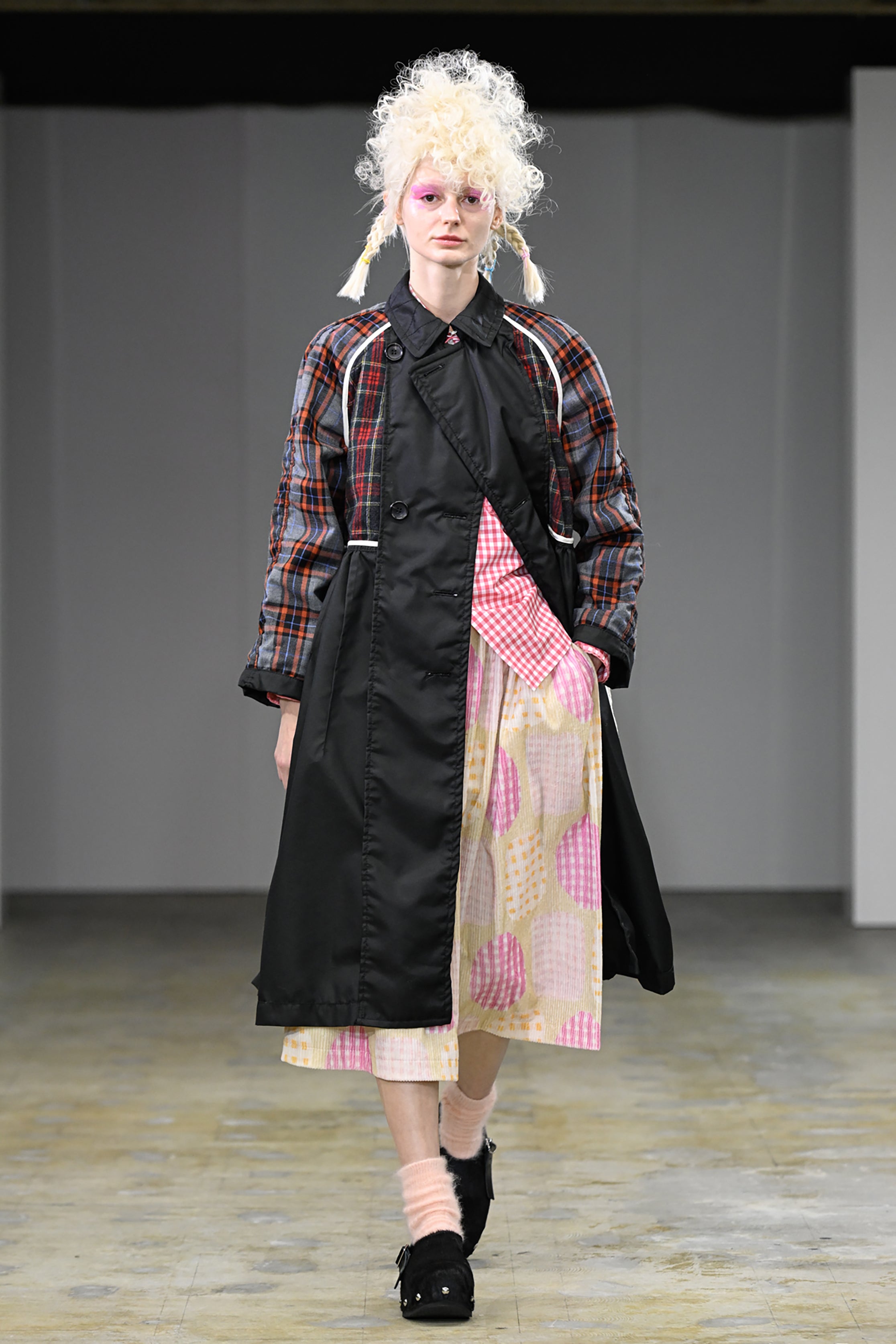 Fashion model wearing a tao AW26 outfit