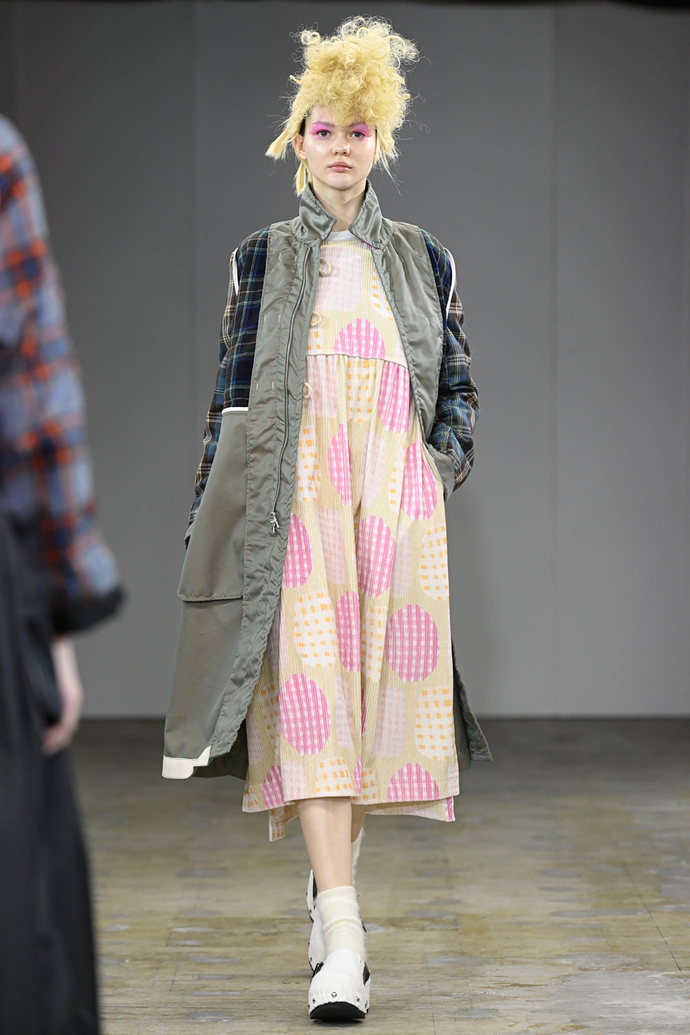 Fashion model wearing a tao AW26 outfit