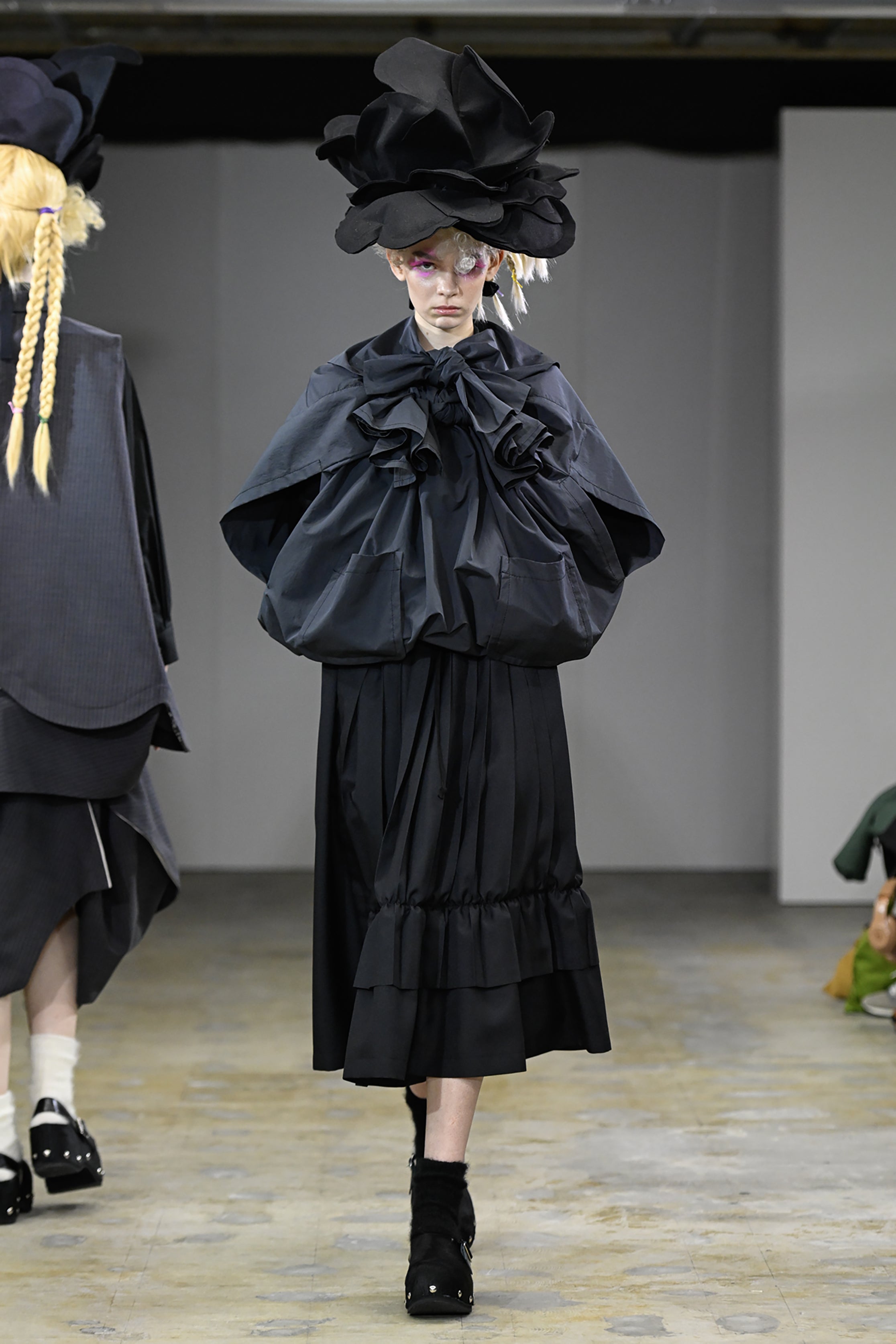 Fashion model wearing a tao AW26 outfit