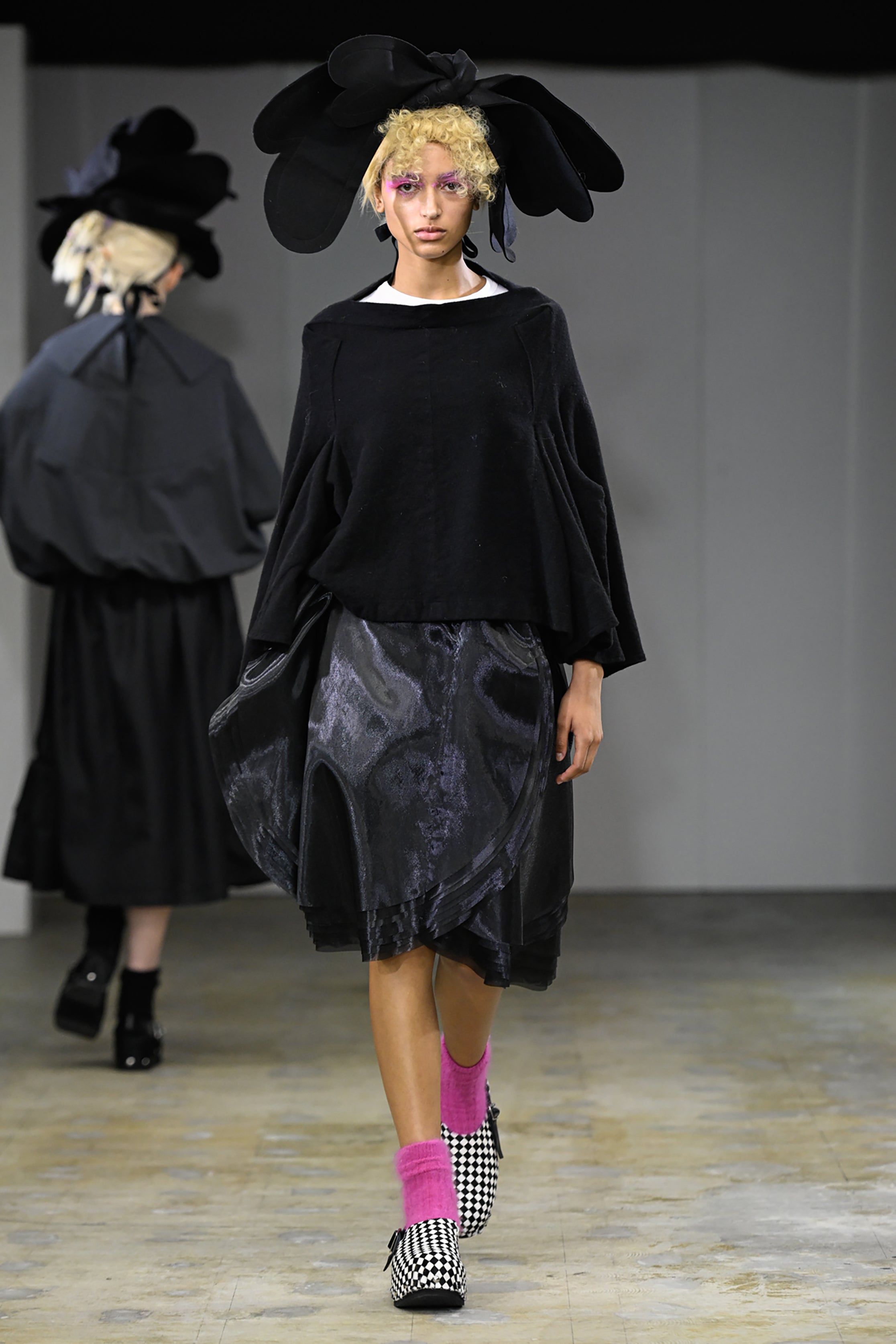 Fashion model wearing a tao AW26 outfit