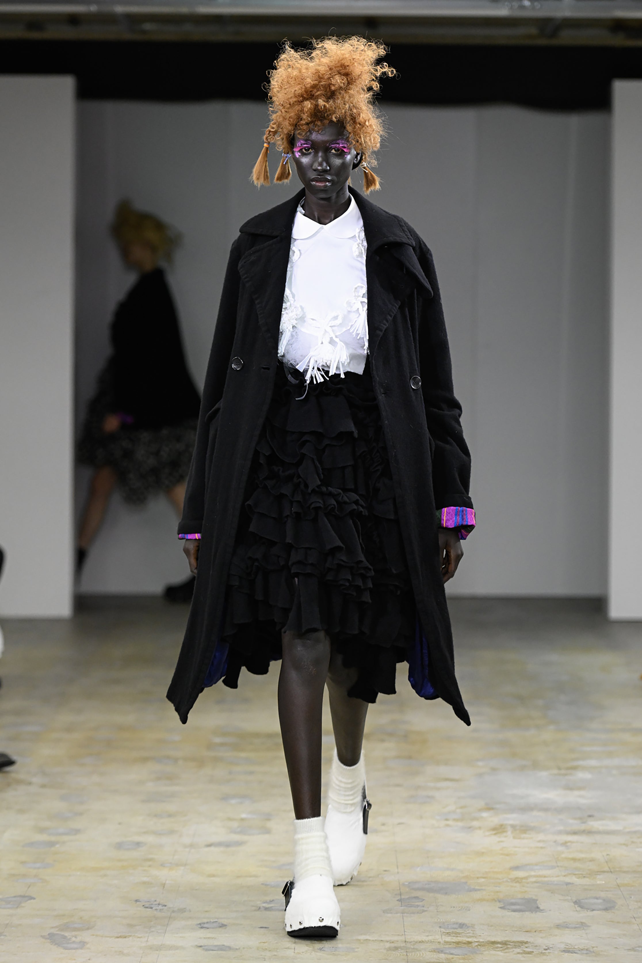 Fashion model wearing a tao AW26 outfit