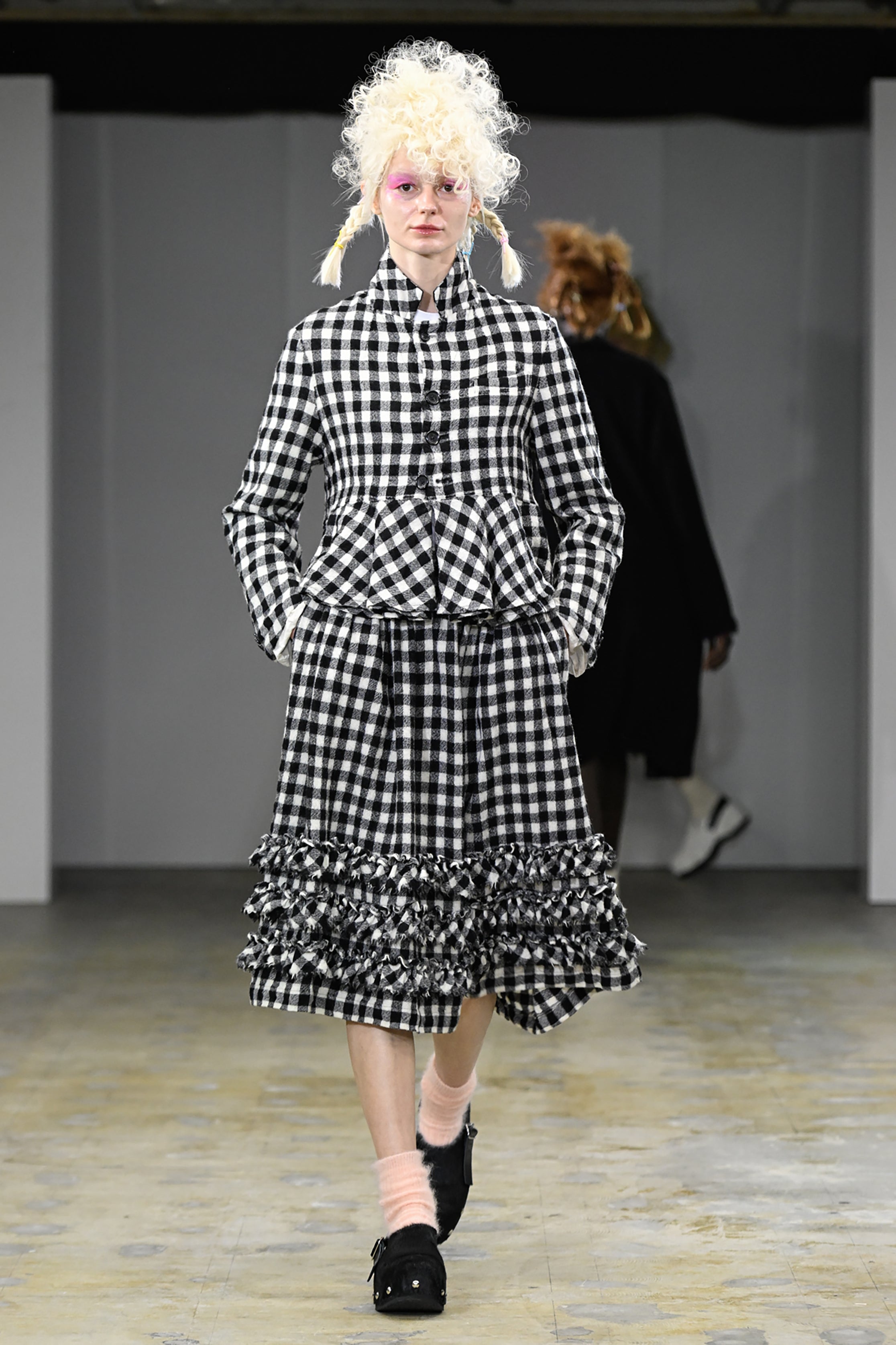 Fashion model wearing a tao AW26 outfit