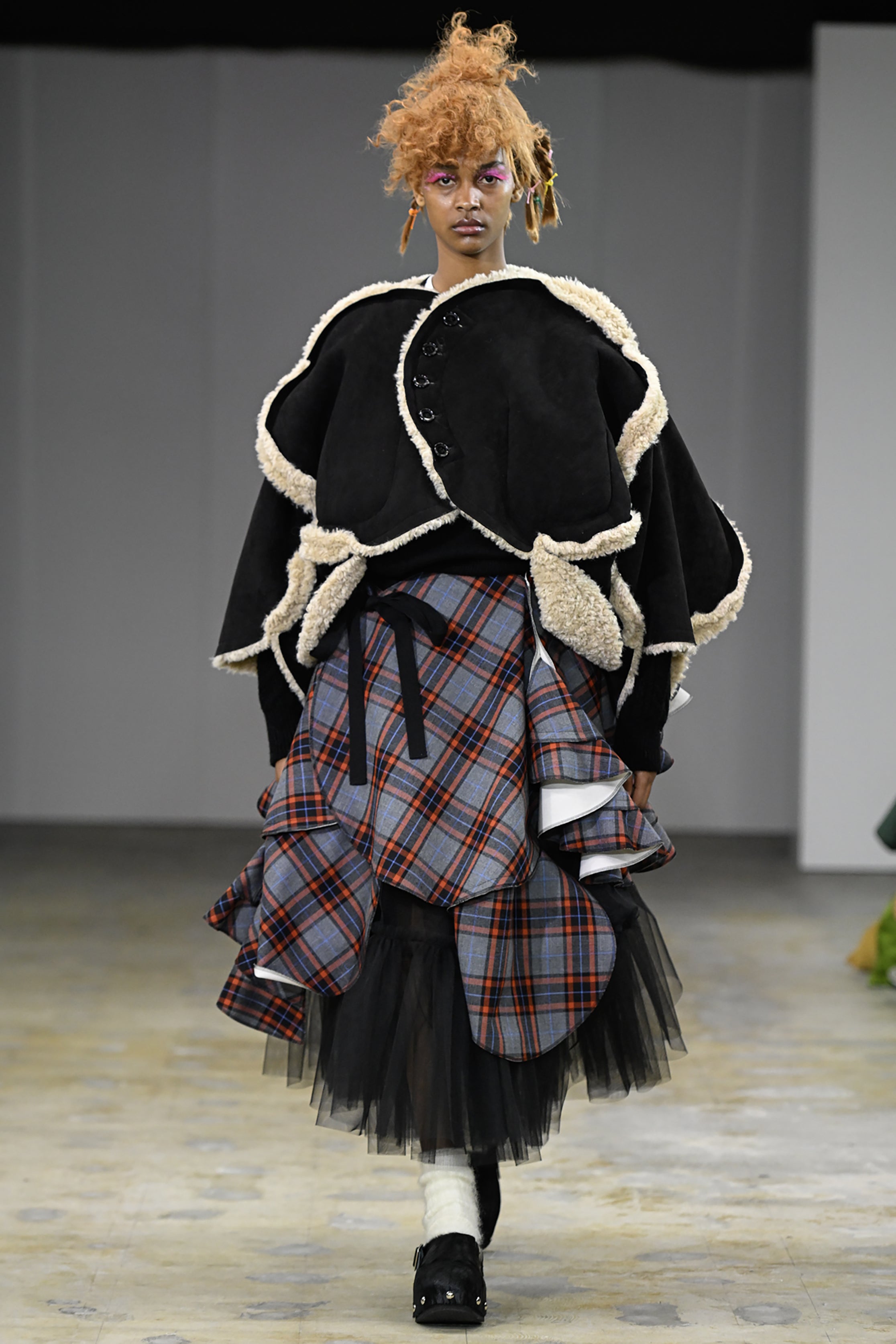 Fashion model wearing a tao AW26 outfit