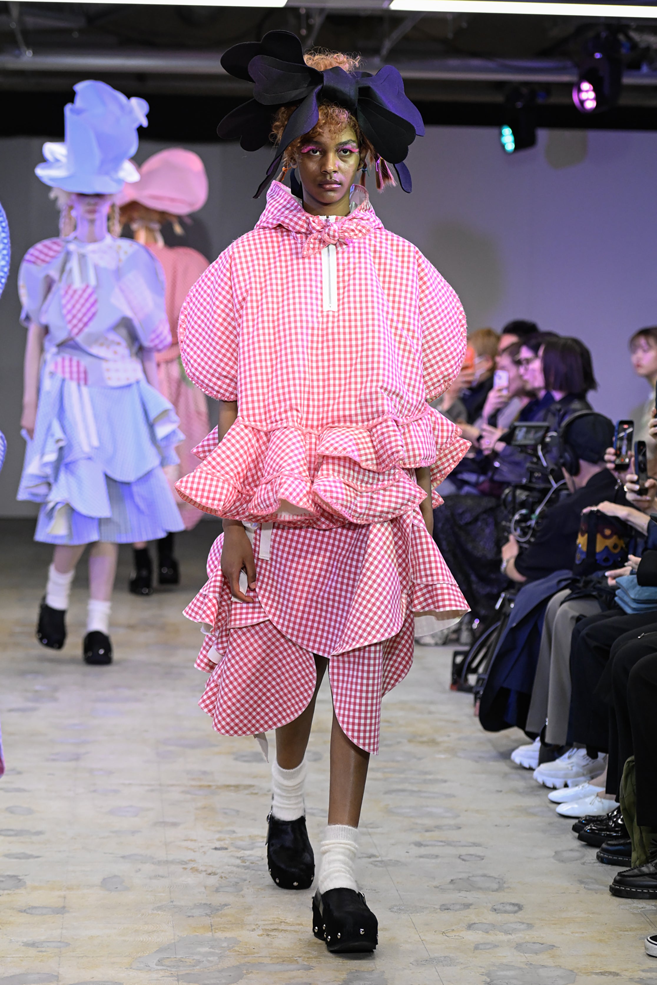 Fashion model wearing a tao AW26 outfit