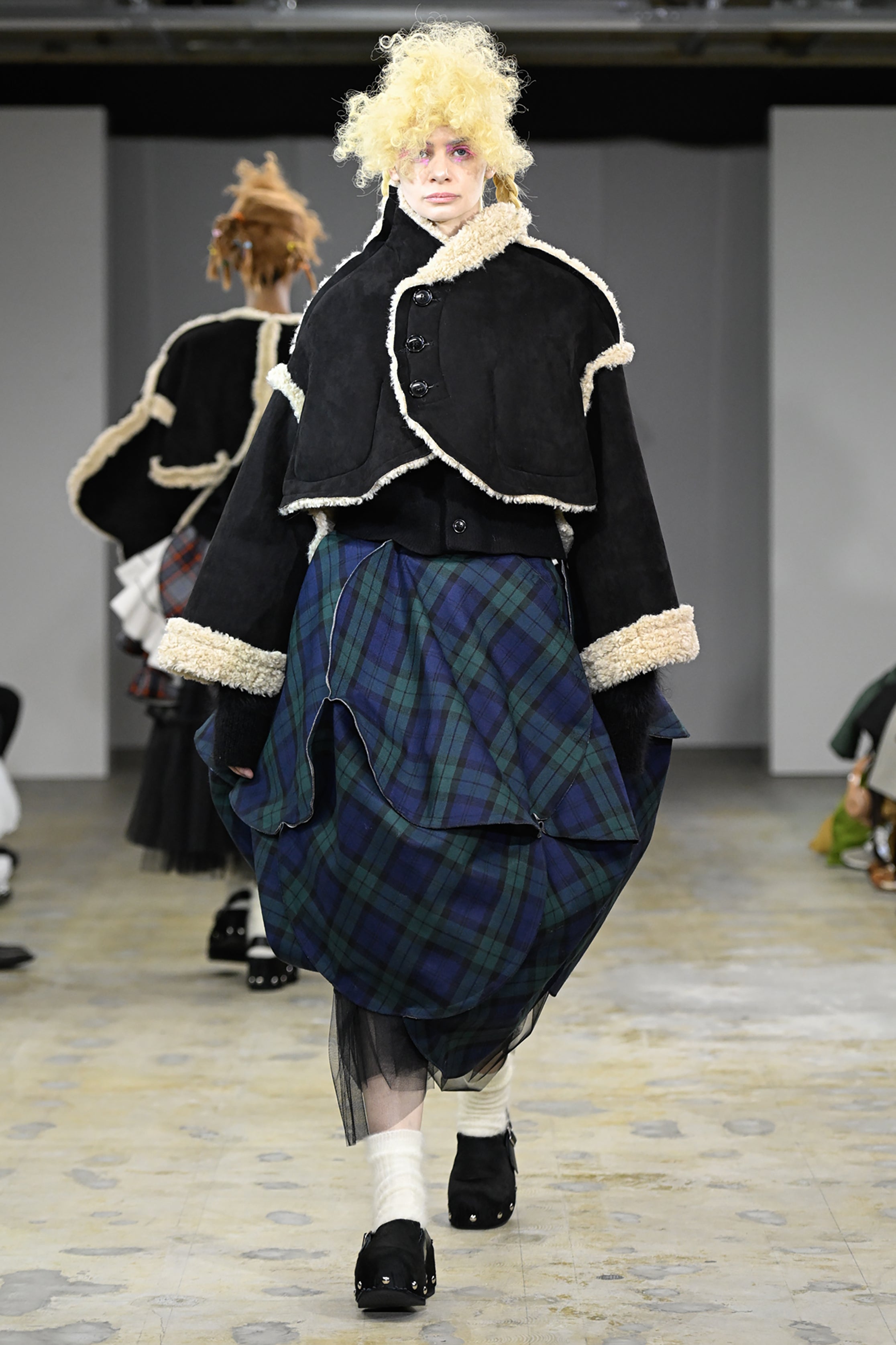 Fashion model wearing a tao AW26 outfit