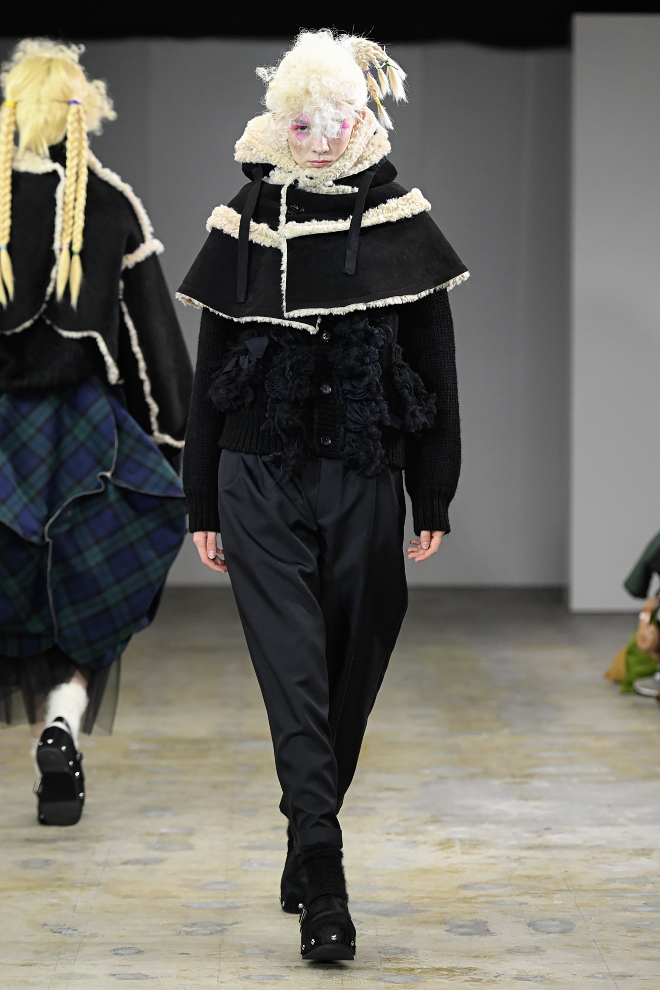 Fashion model wearing a tao AW26 outfit