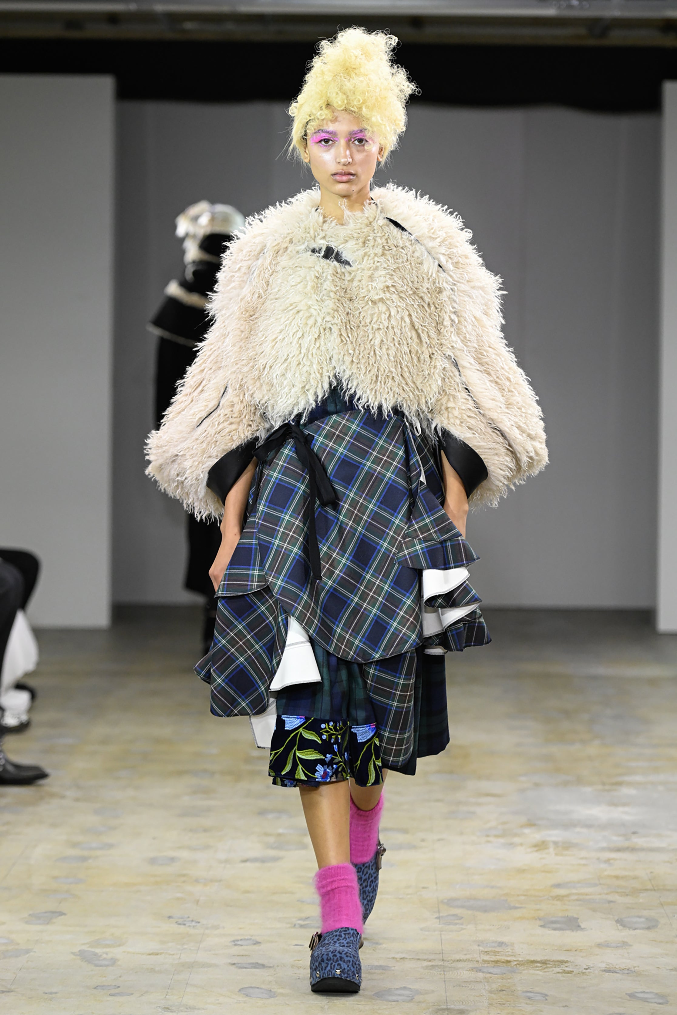 Fashion model wearing a tao AW26 outfit