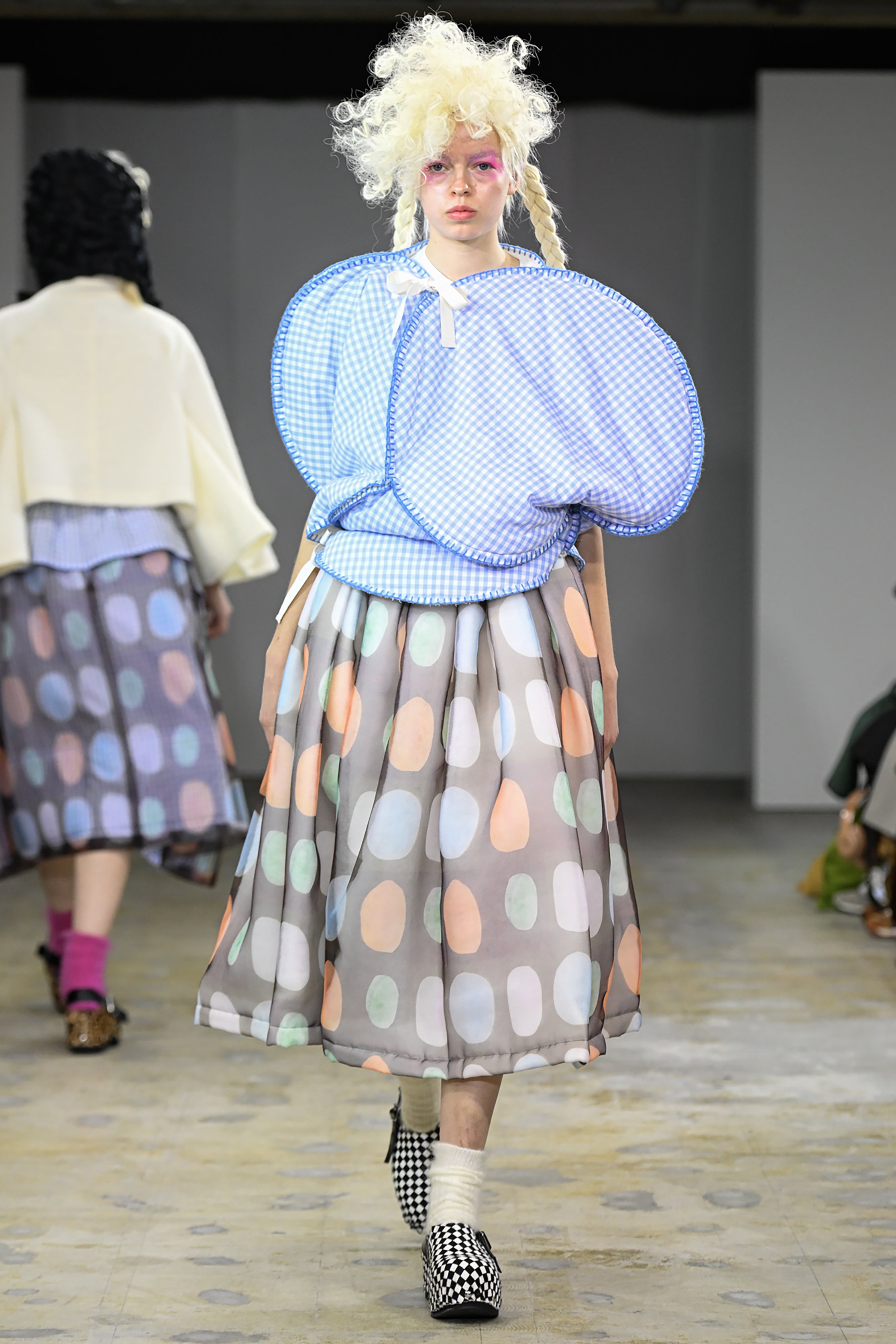 Fashion model wearing a tao AW26 outfit