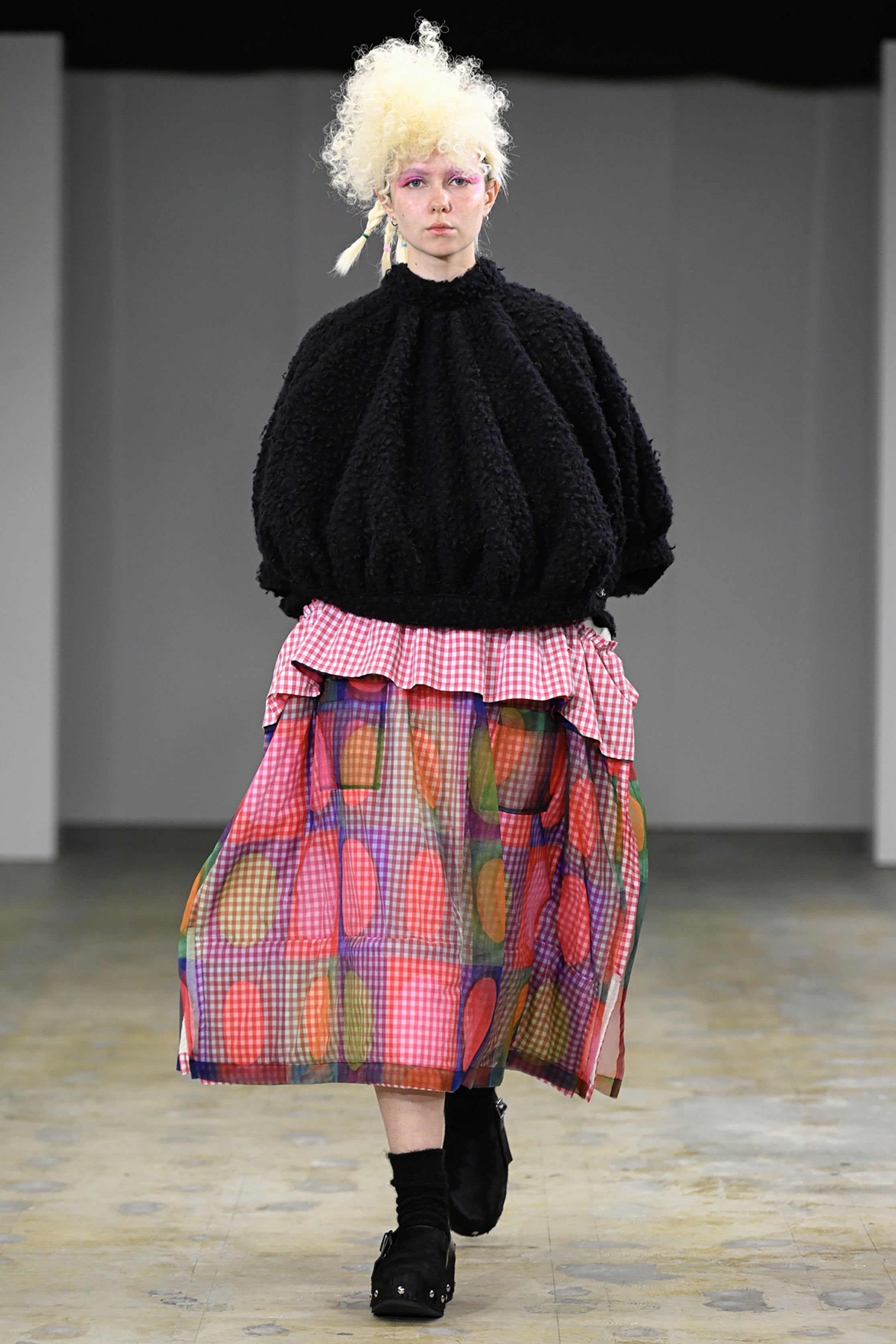 Fashion model wearing a tao AW26 outfit