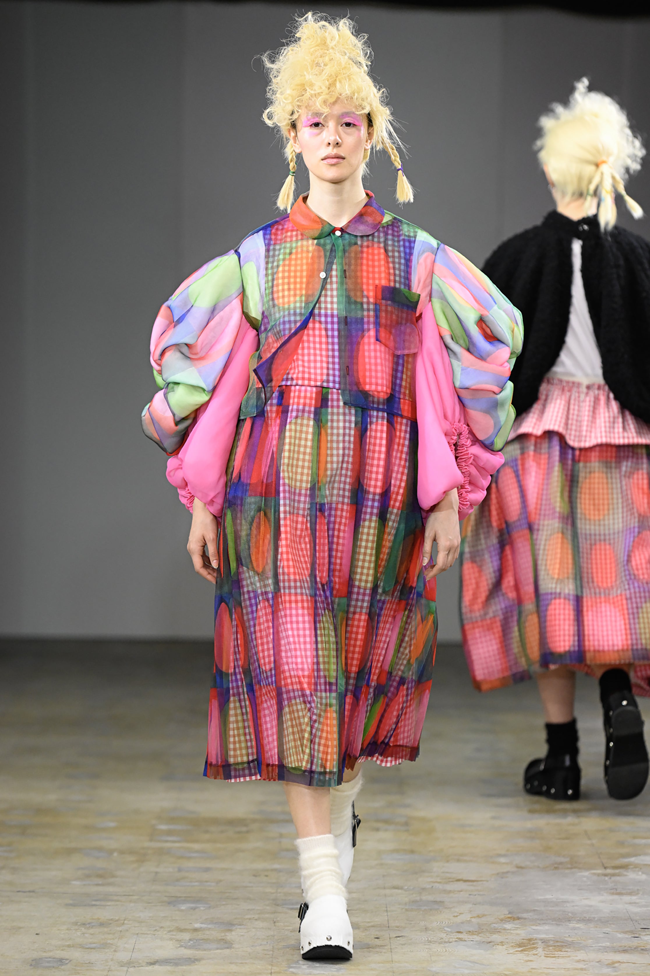 Fashion model wearing a tao AW26 outfit