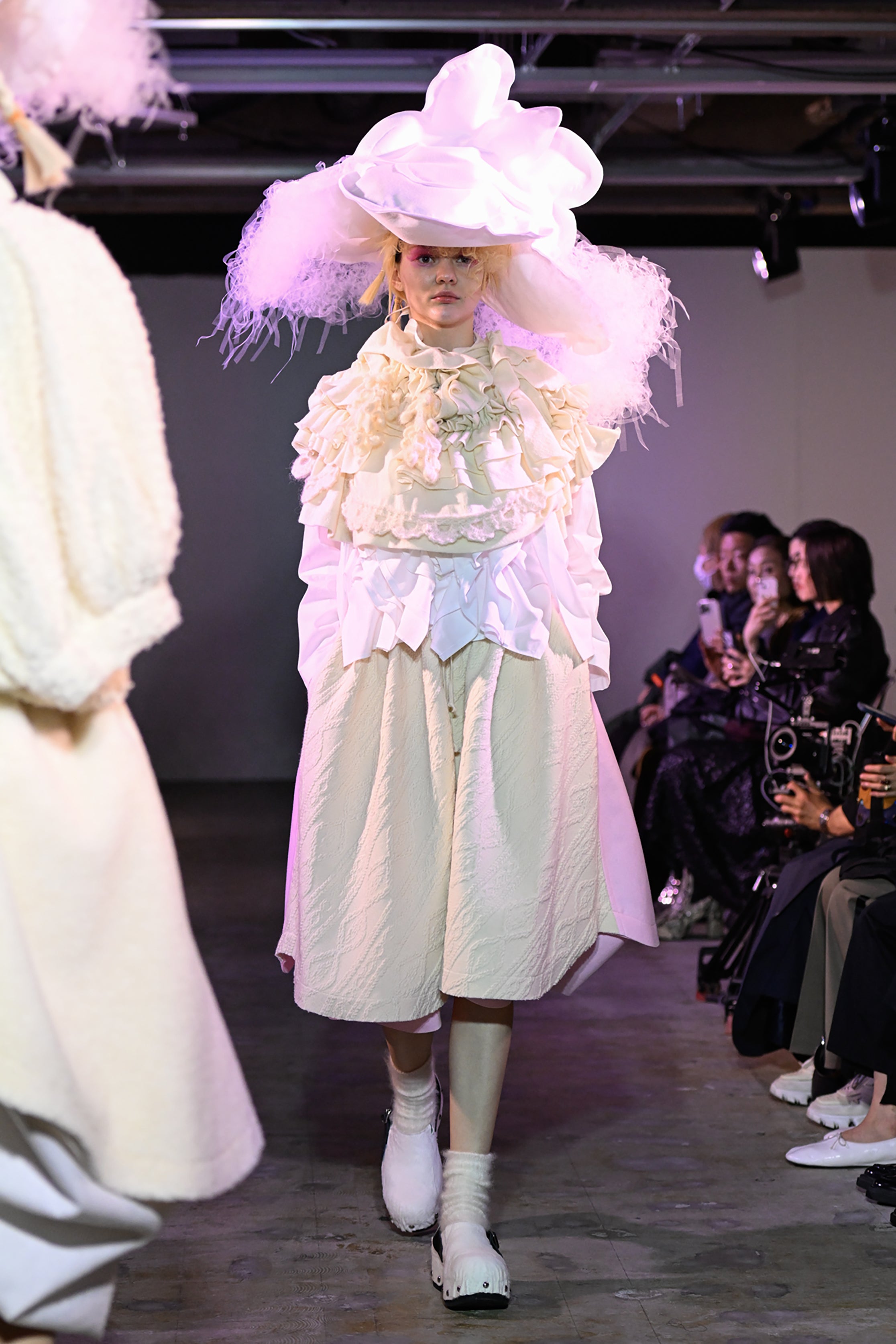 Fashion model wearing a tao AW26 outfit