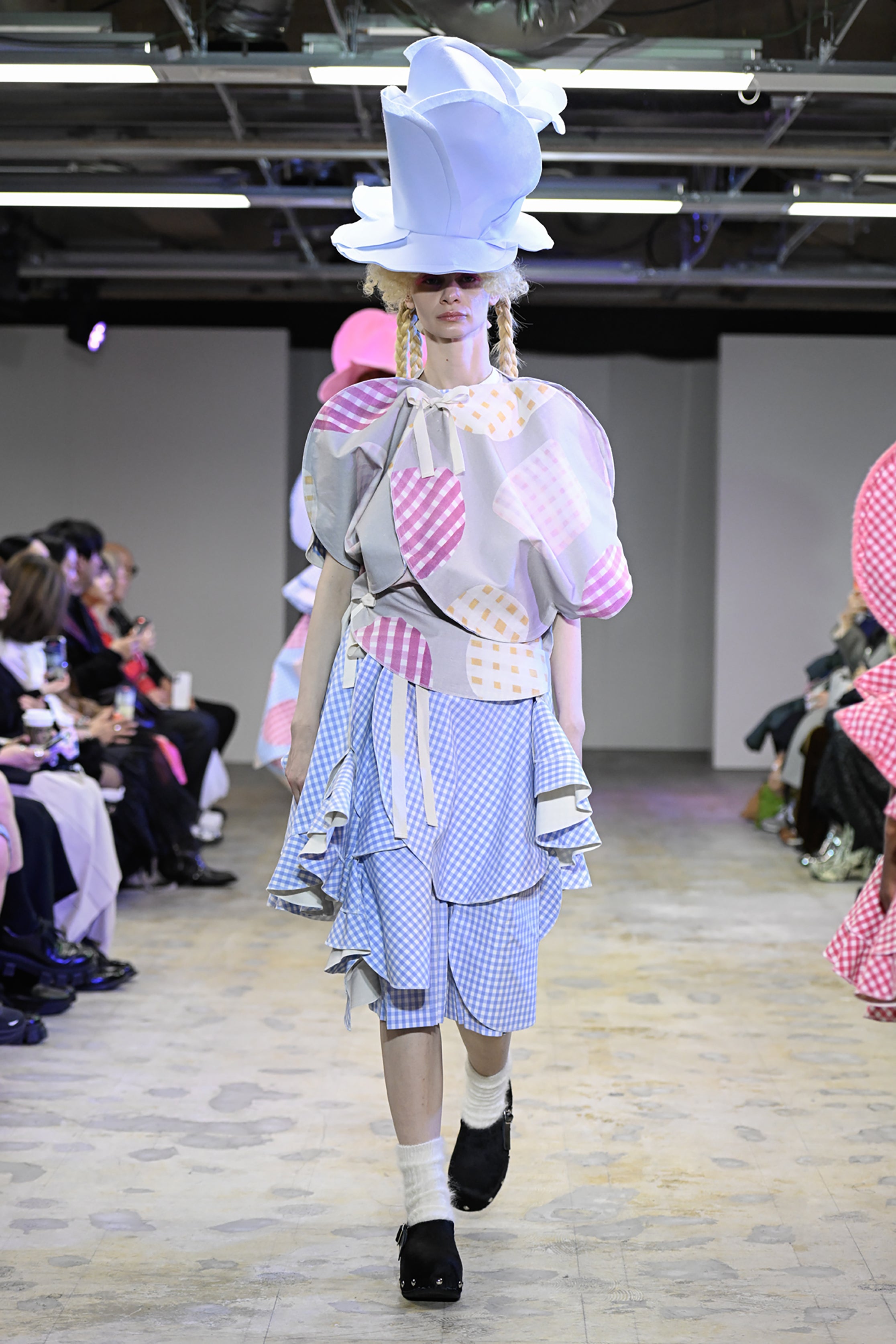 Fashion model wearing a tao AW26 outfit