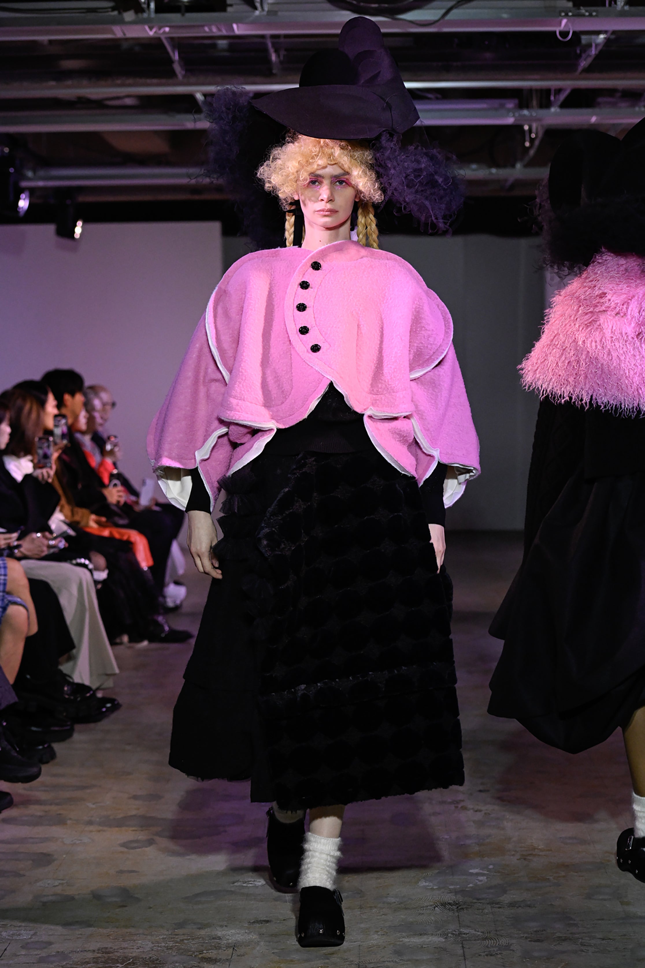 Fashion model wearing a tao AW26 outfit