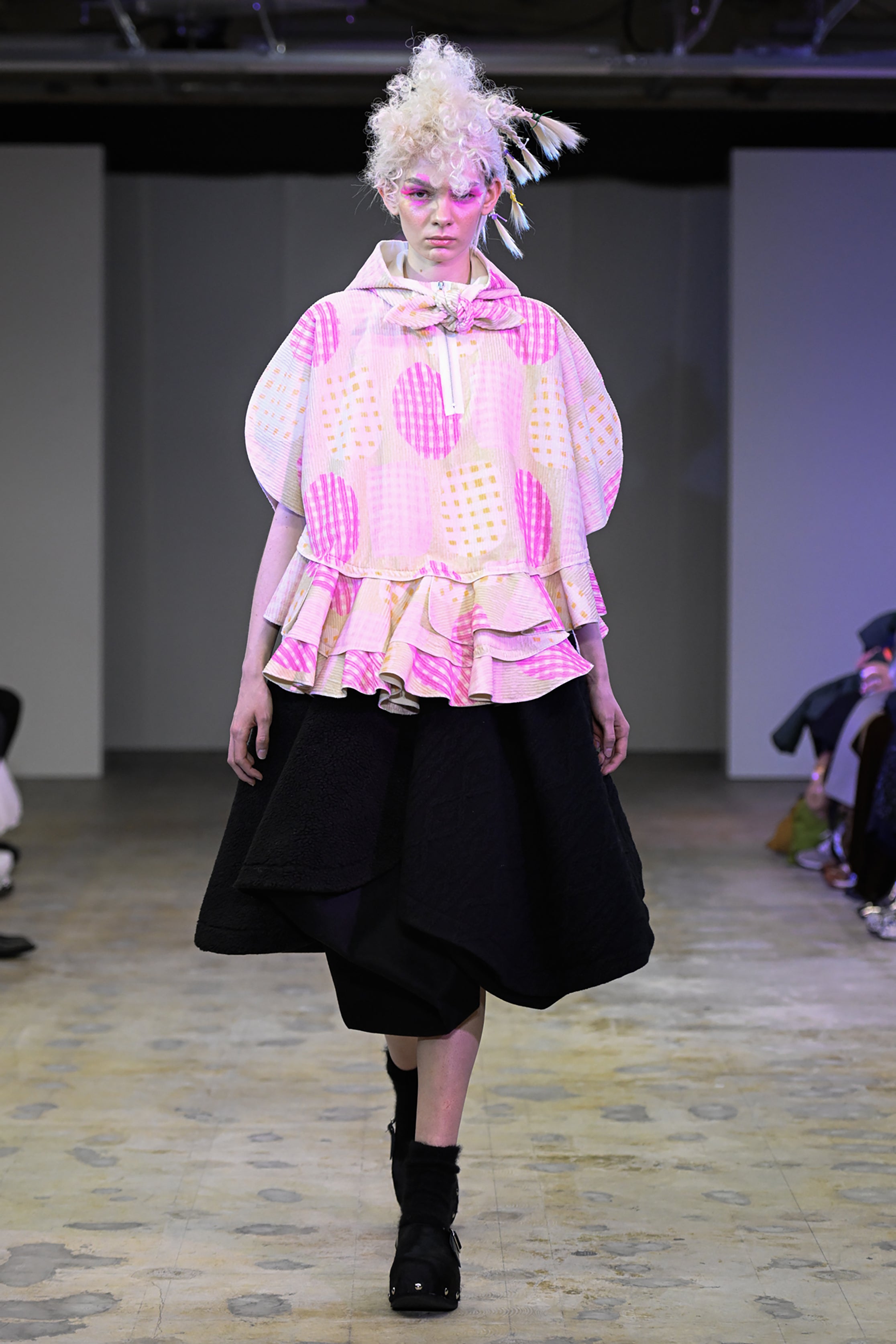 Fashion model wearing a tao AW26 outfit