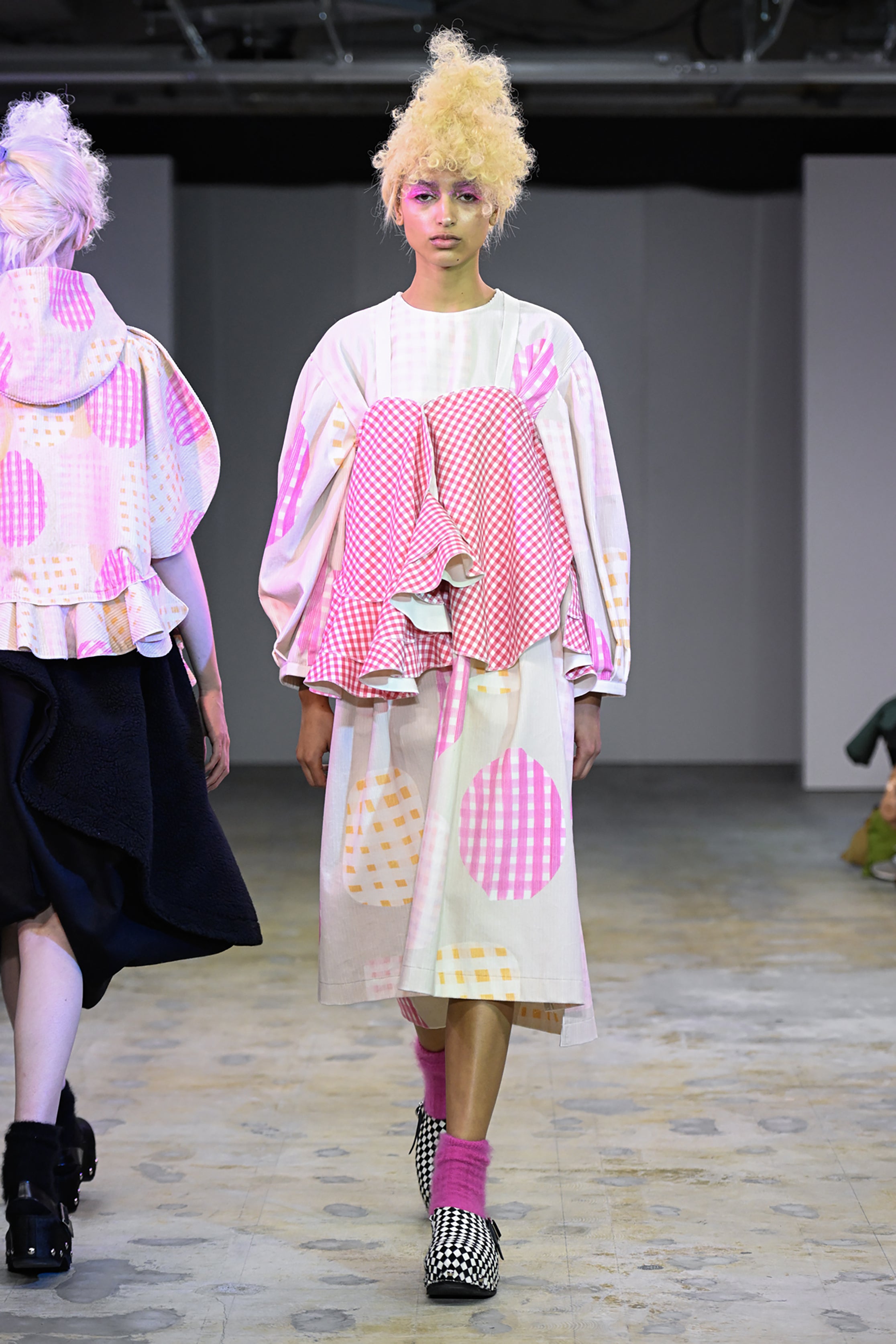 Fashion model wearing a tao AW26 outfit