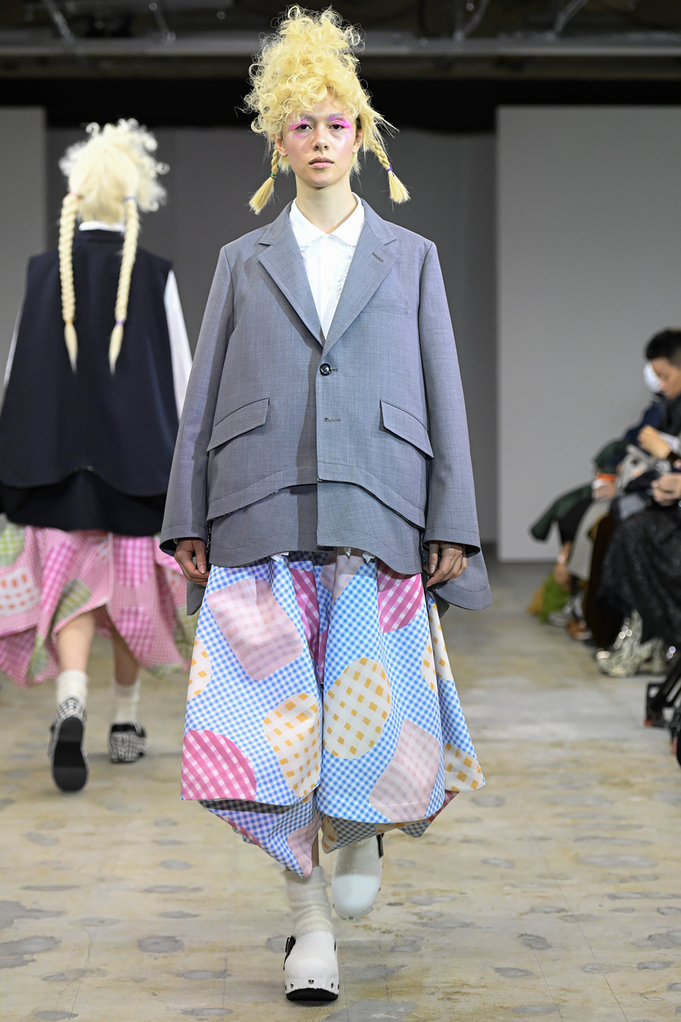 Fashion model wearing a tao AW26 outfit